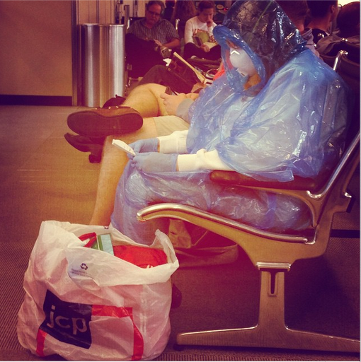 Airport woman in hazmat suit - Ebola comedy